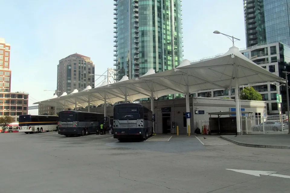 Greyhound and Amtrak buses at a temporary bus terminal in San Francisco, California.